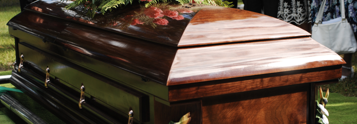 Coffin at a funeral service in a cemetery